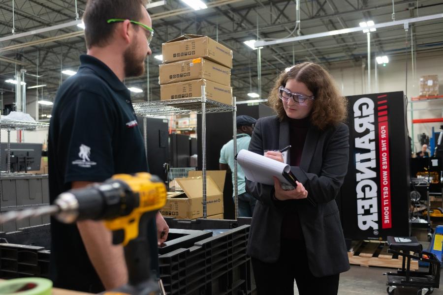 A professional woman and man in a Grainger facility